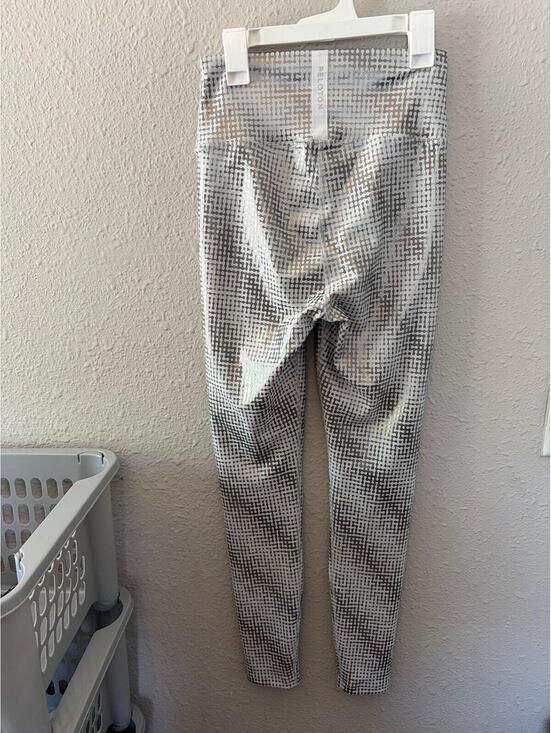 Peloton Pants - Peloton white/silver print leggings size M. Tag removed but waist measures again